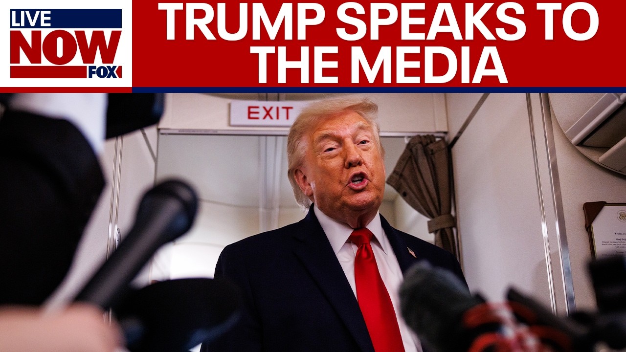 President Trump speaks with reporters aboard AF1