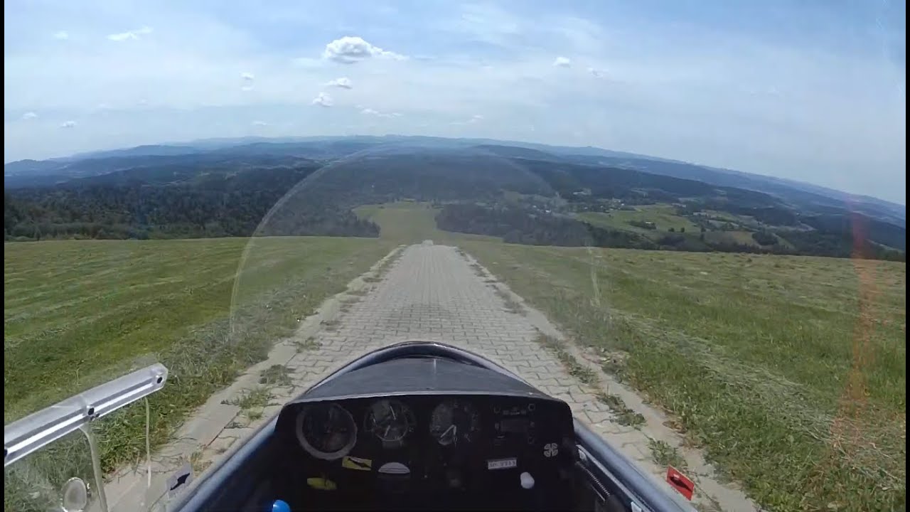 Sailplane does a gravity take off from top of a hill - cockpit view