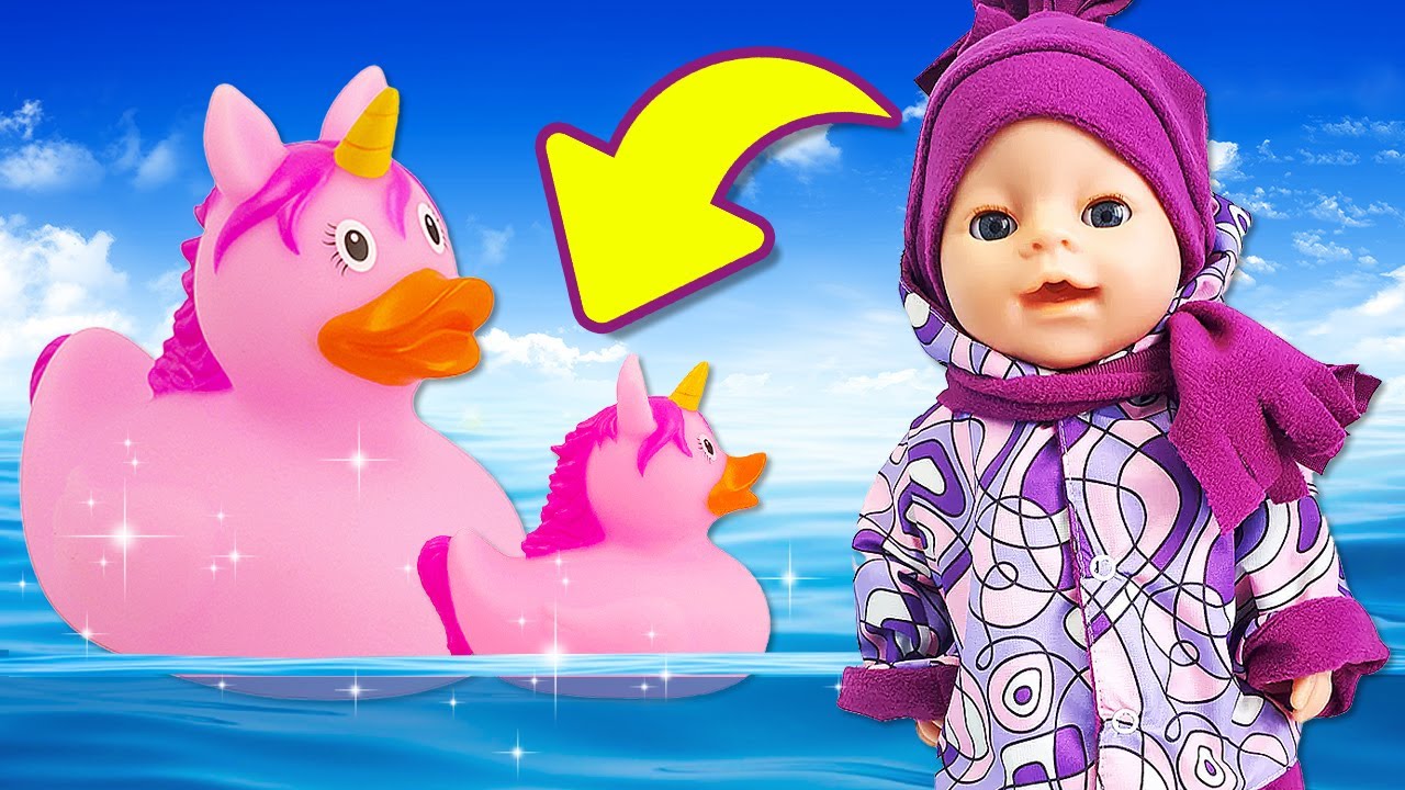 Maya goes for a walk with her baby doll and looks after her with her mother.