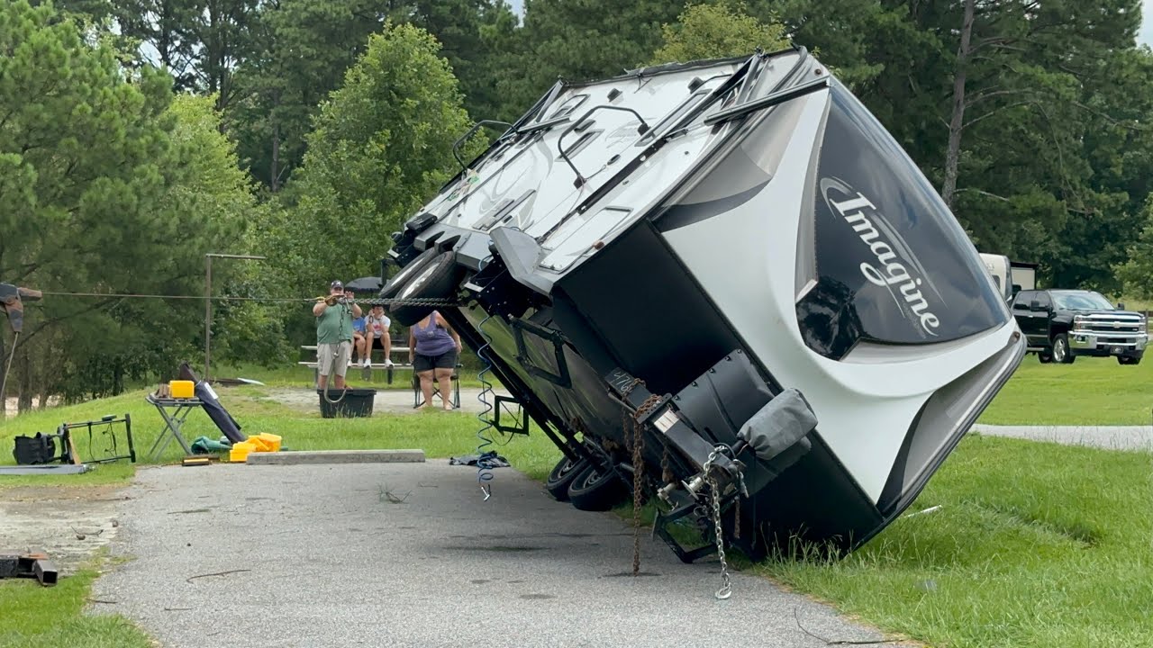 RV Being Winched Back Up After High Winds Pushed it Over
