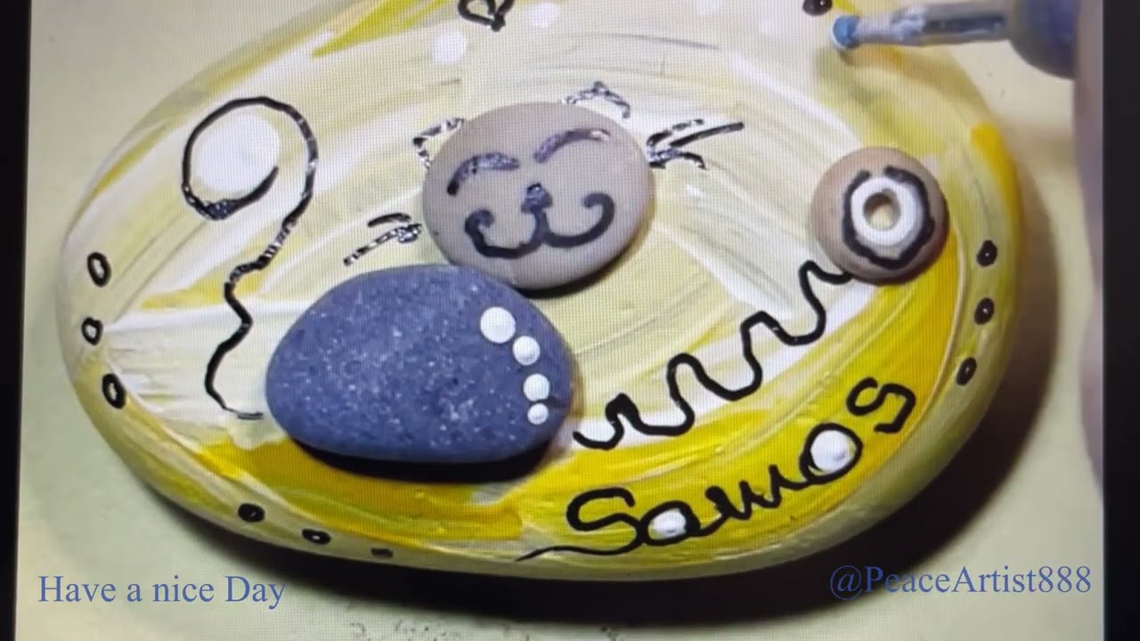 23. #CreateDIY a #Cat with pebbles on painted rock. #Fridgemagnet with Kitty and shells.