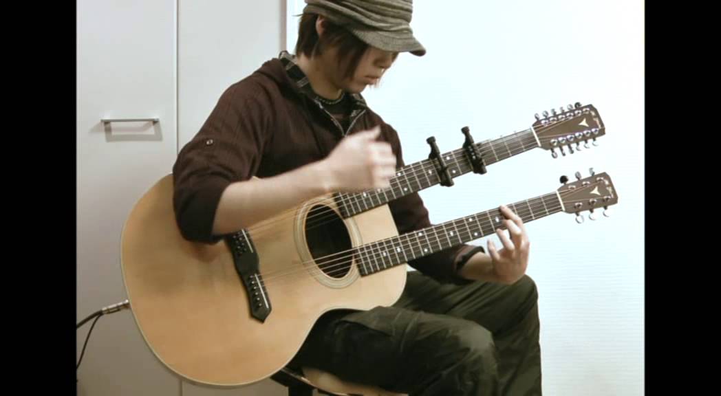T-cophony plays the double-neck guitar 