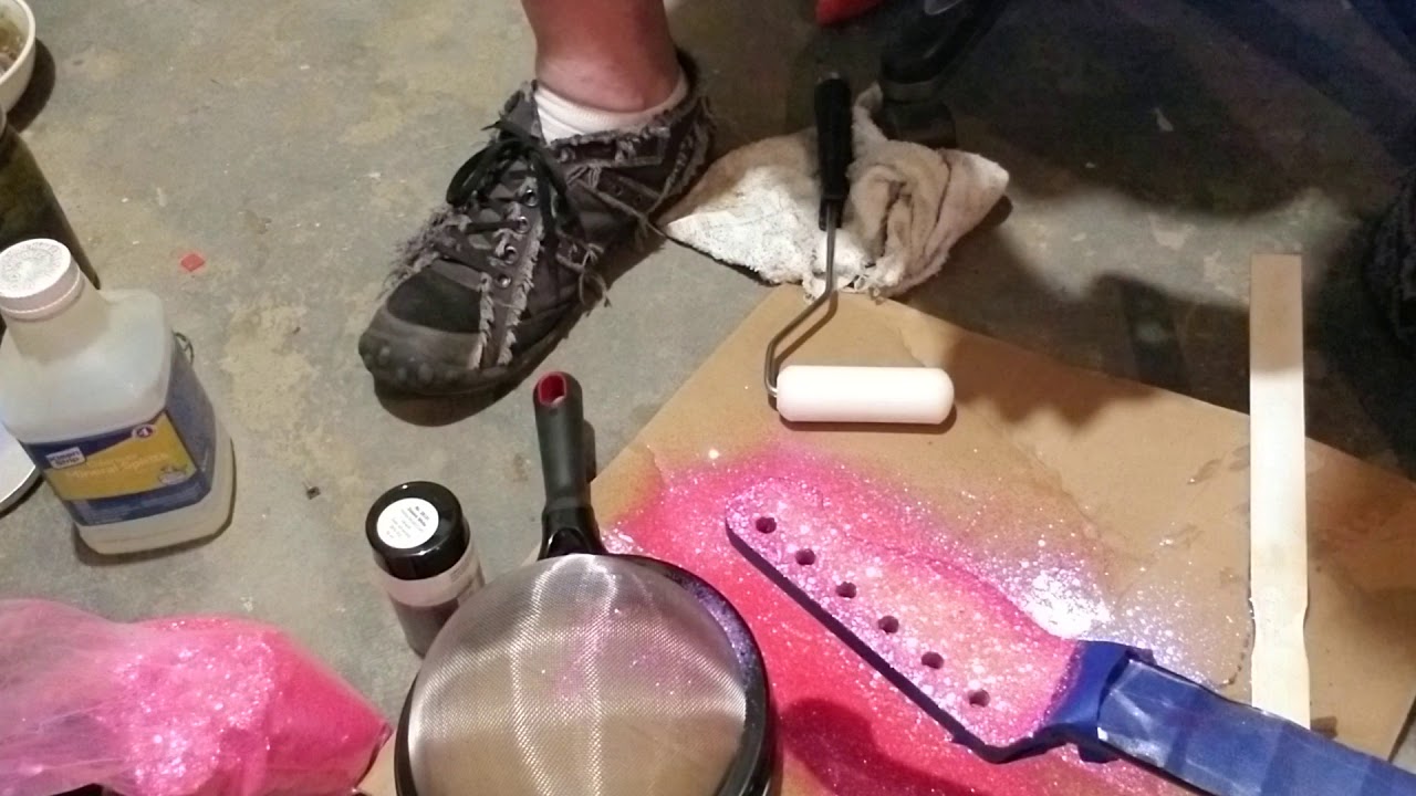 Glitter metallic flake sprinkle application to guitar headstock