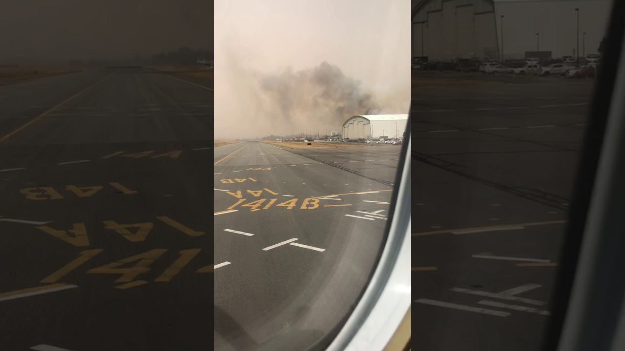 Smoke Drifts Across Runway From Fire Near Canberra Airport