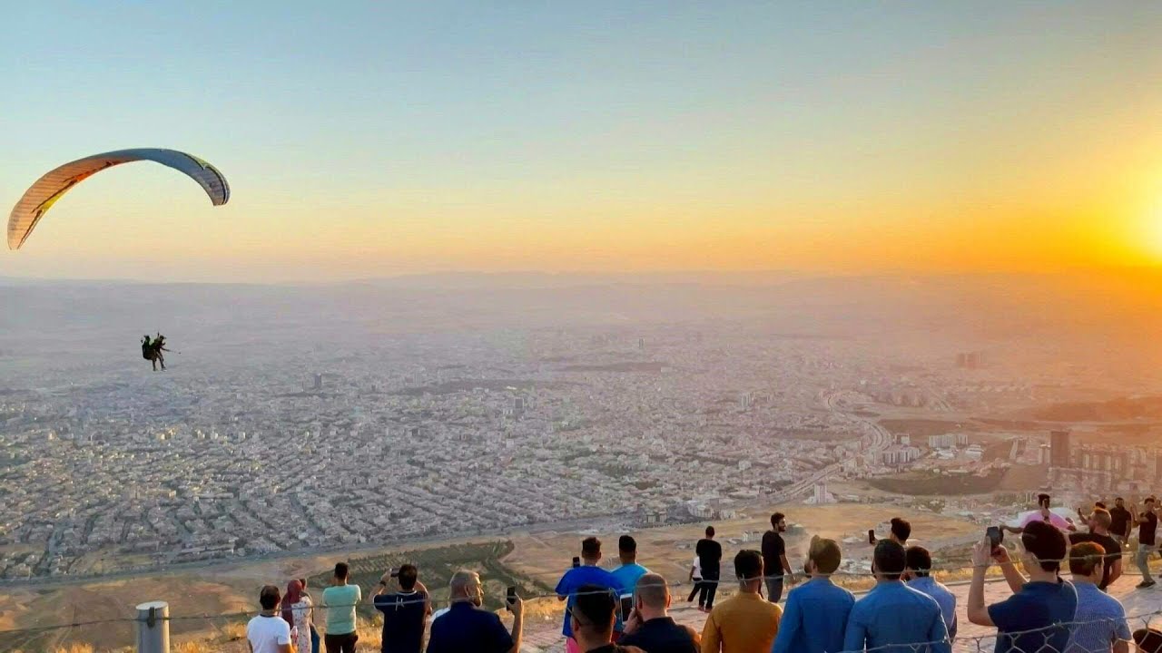 Iraqi paragliding team launches over Kurdistan's Sulaimaniyah | AFP