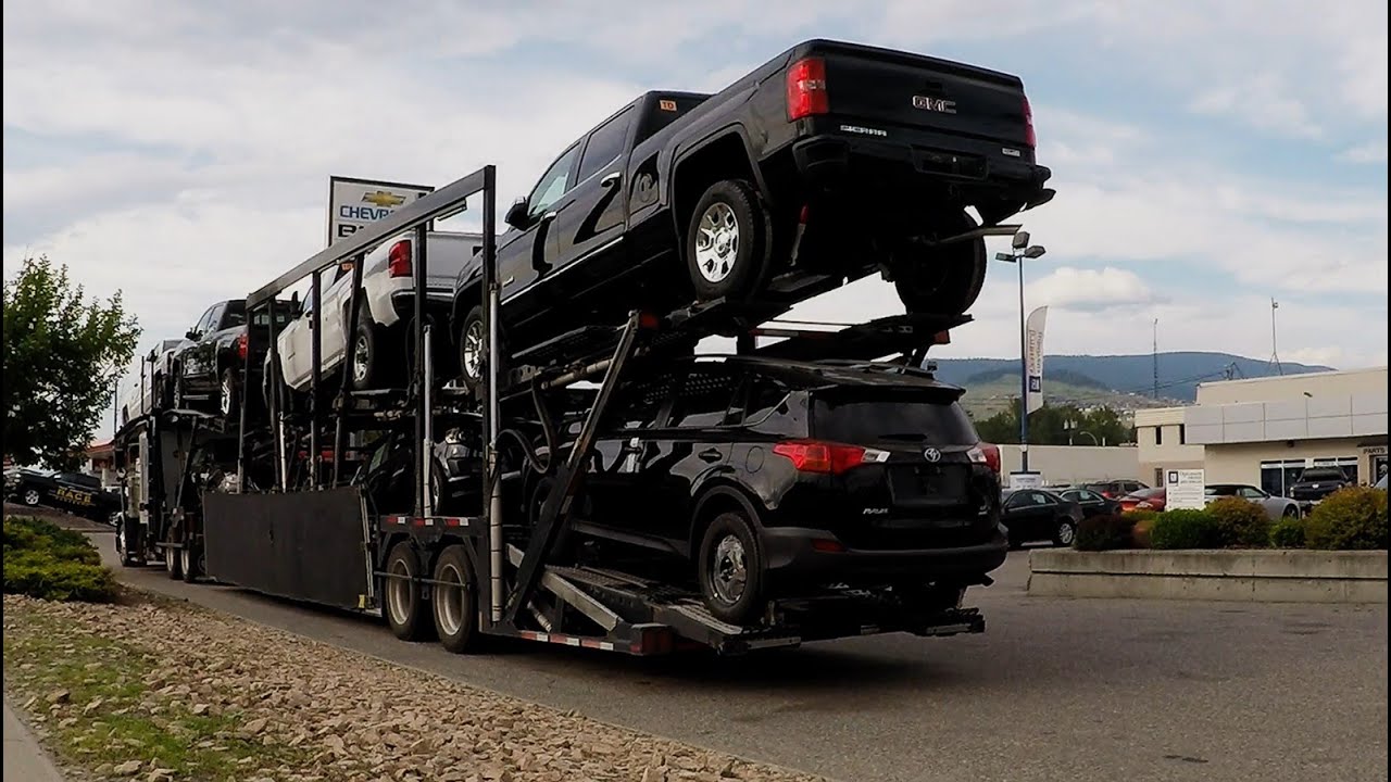AUTO TRANSPORT CARRIER #03 -- GM, GMC, BUICK VEHICLES UNLOADED AT DEALERSHIP