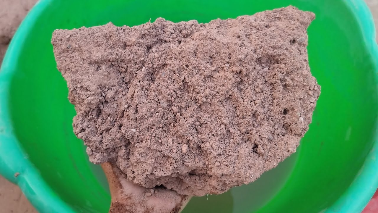 Gritty Red Dirt Crumbling in Water 