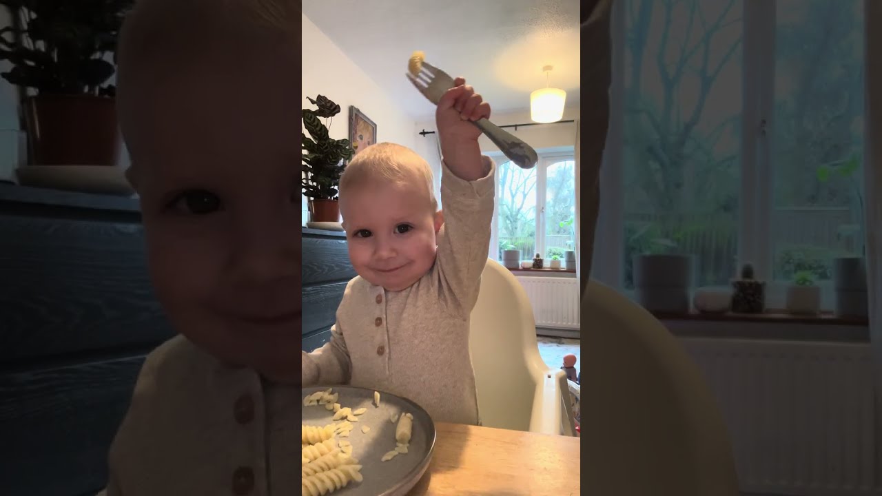 1 year old eating by himself 