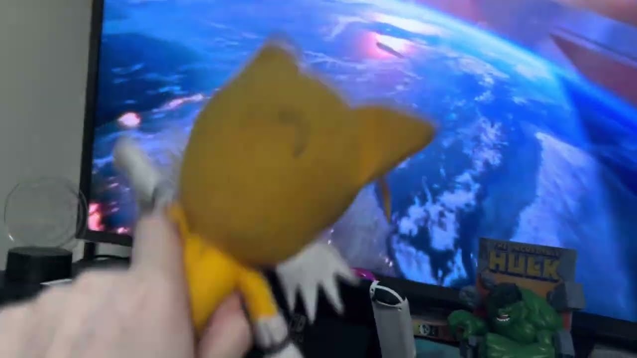 Tails watches the universal logo.
