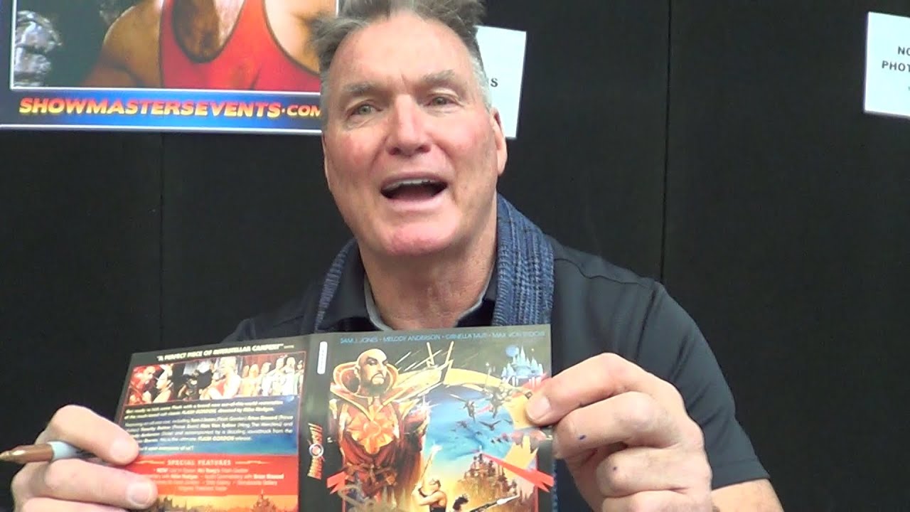 SAM J. JONES signs a Flash Gordon 1980 DVD for Children's Charity 4/3/23 + signed by Brian Blessed !