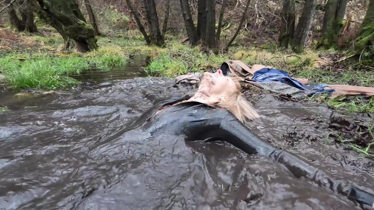 Video 97 - Flood pla'in - Taster (latex catsuit, riding boots, jodhpurs, mud, water, wetlook, wam)