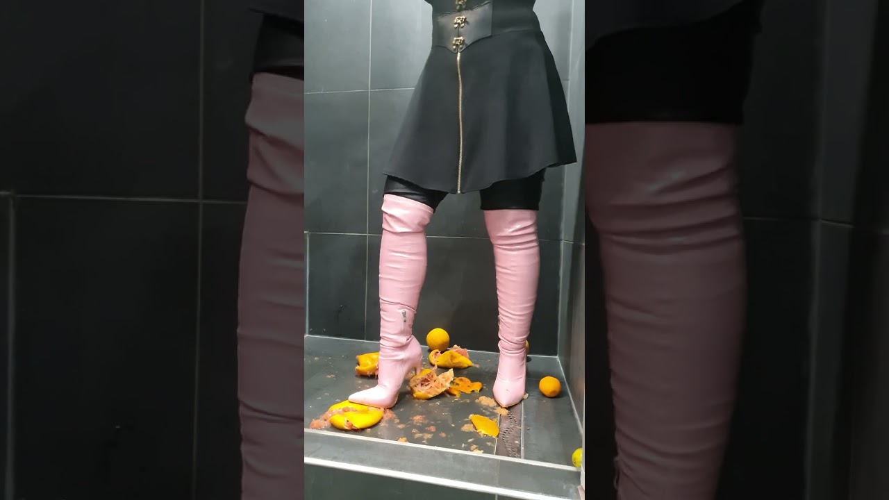 Attractive Lady in Leather Leggings and Over Knee High Heel Boots Crushing Citrus Fruit! 😘❤️️😘