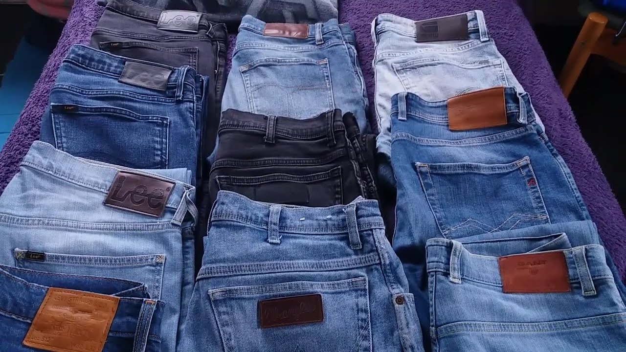 Eleven pairs of second hand jeans