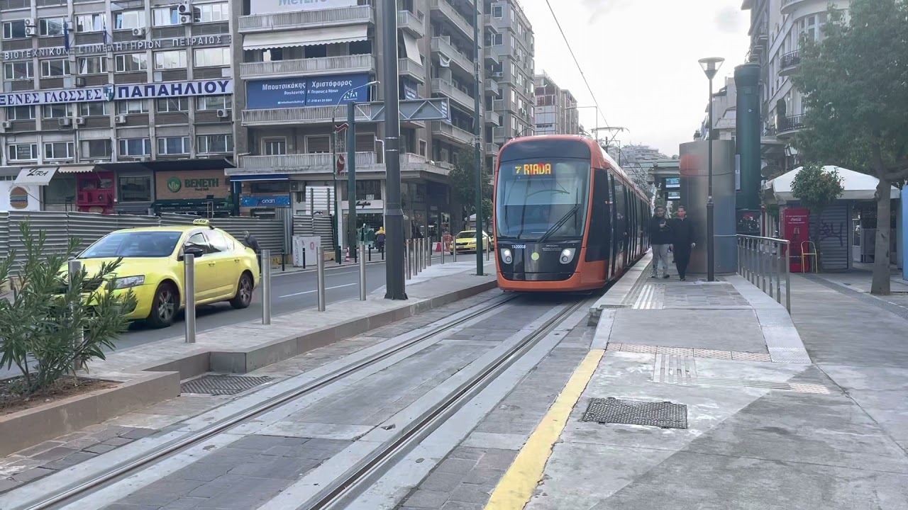 Athens Line 7 tram arriving and departing from  Dimarhio station