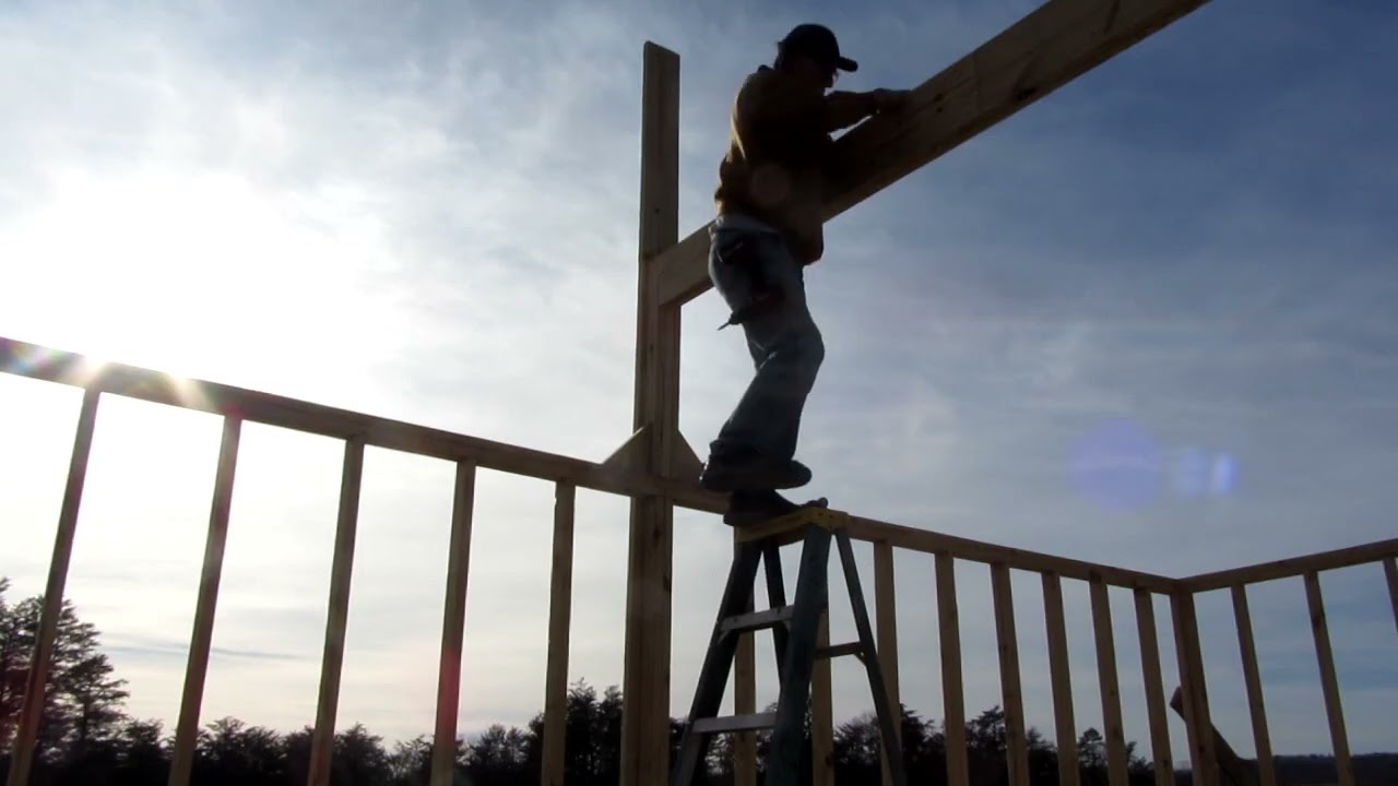 Building 24 foot ridge beam in place for Solar Shed.