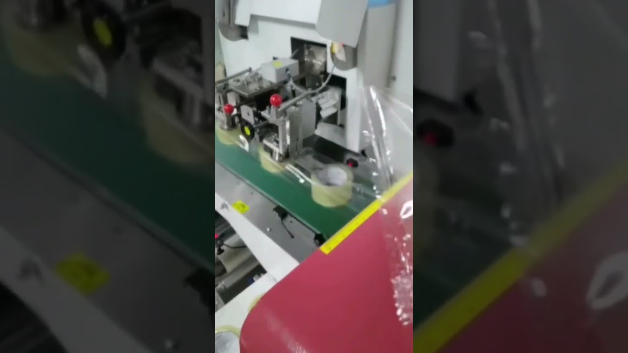 Pillow type adhesive tape packing machine 