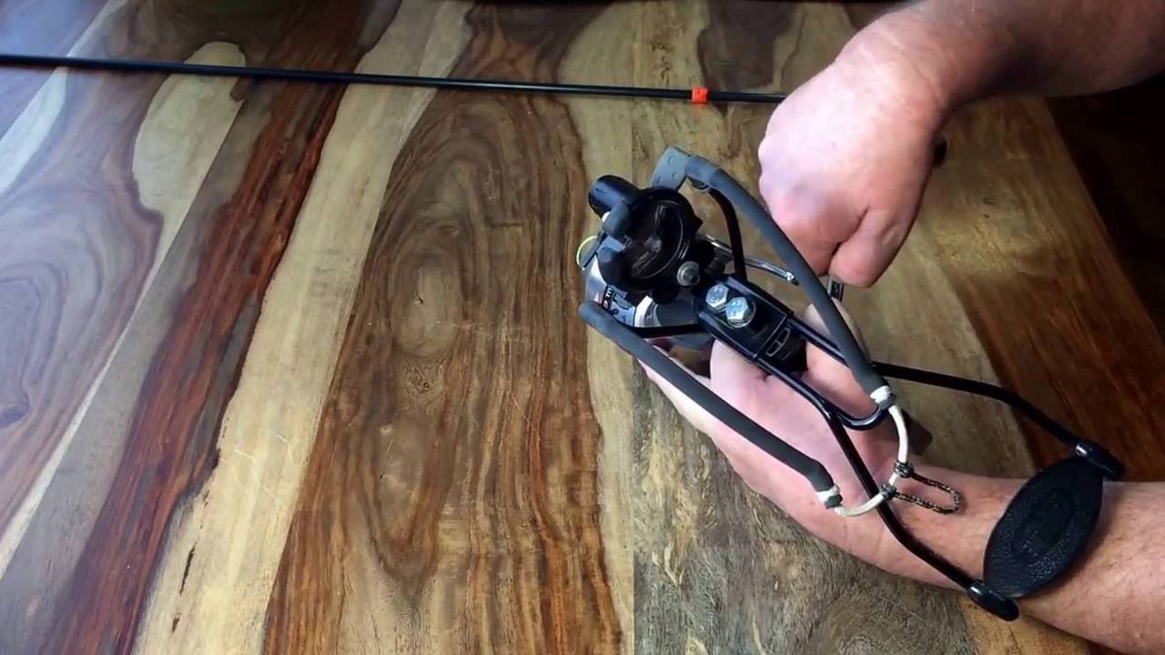 Slingbow with fishing reel