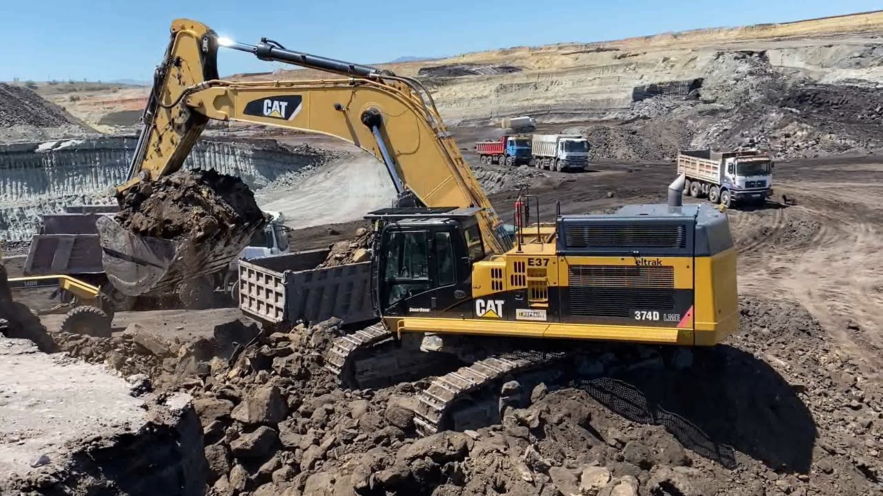 Caterpillar 374D Excavator Loading Trucks