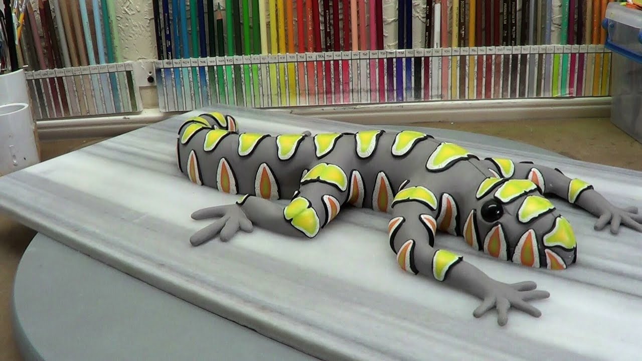Sculpting a lizard, part 5.  applying cane slices.