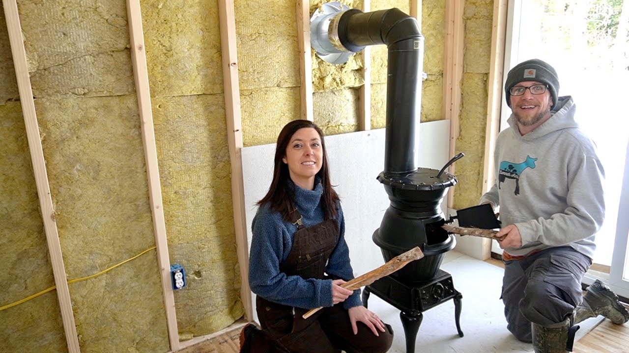 Installing an Old CAST IRON Wood Stove to HEAT our OFF-GRID Shipping Container Cabin in the WOODS
