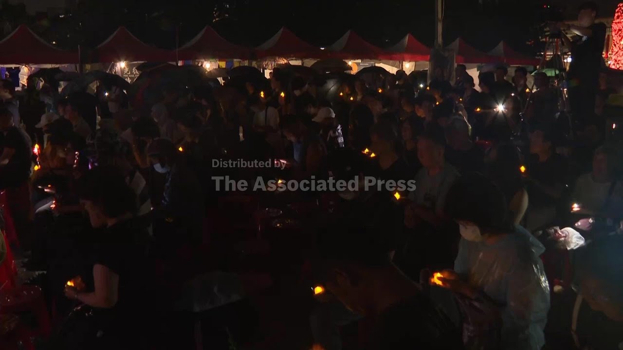 Dozens brave bad weather in Taiwan to honour victims of Tiananmen crackdown