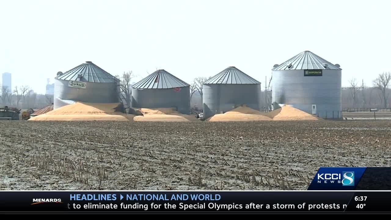 Receding flood waters leave busted Iowa bins
