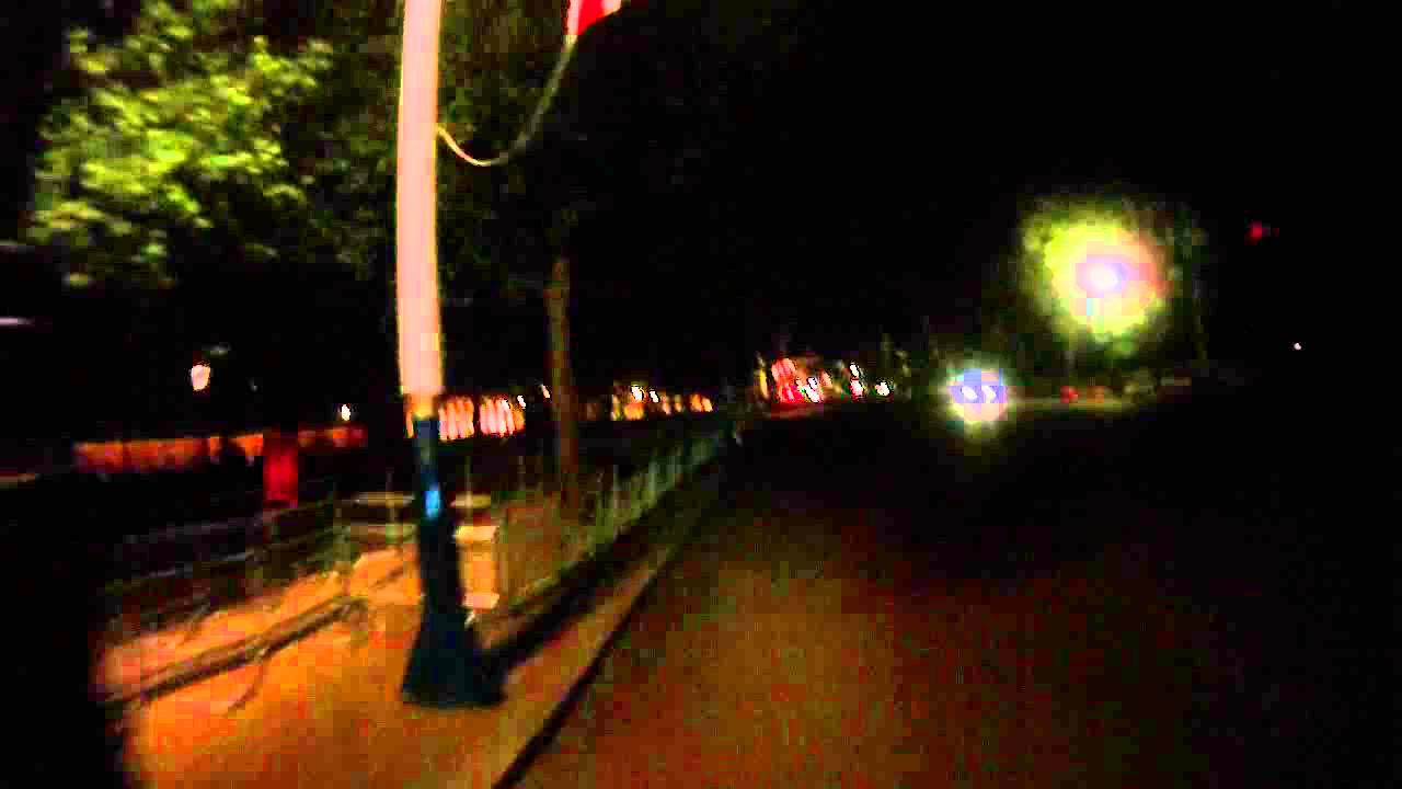 Union Jack flags illuminated along the Mall at night (London)