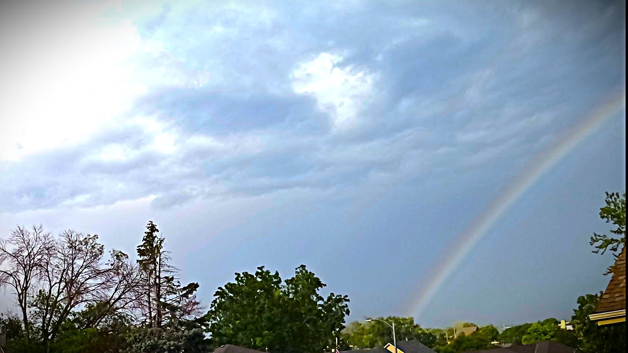 Afternoon thunderstorms with a bright rainbow - August 22, 2025