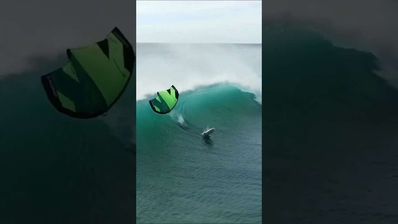 wave crashing 🌊 into wing foiler 