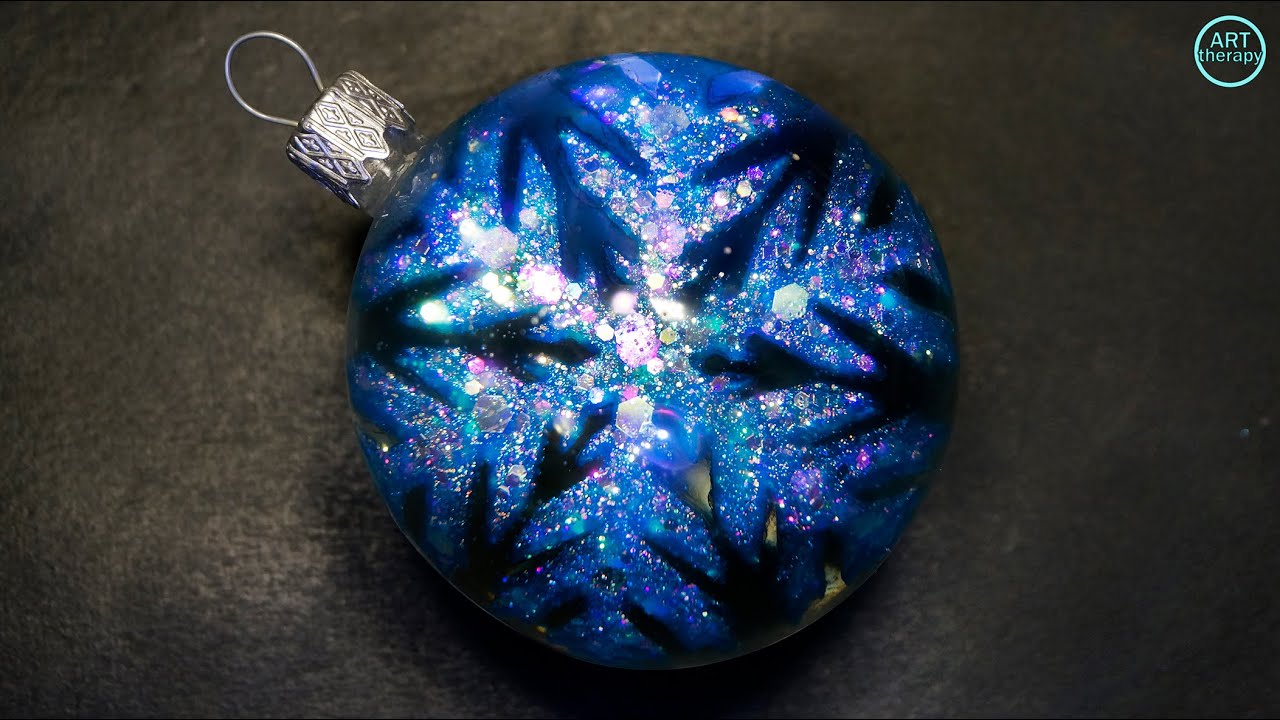 Christmas decoration made of epoxy resin. Snowflake in a ball. Epoxy resin. 3D Resin Art.