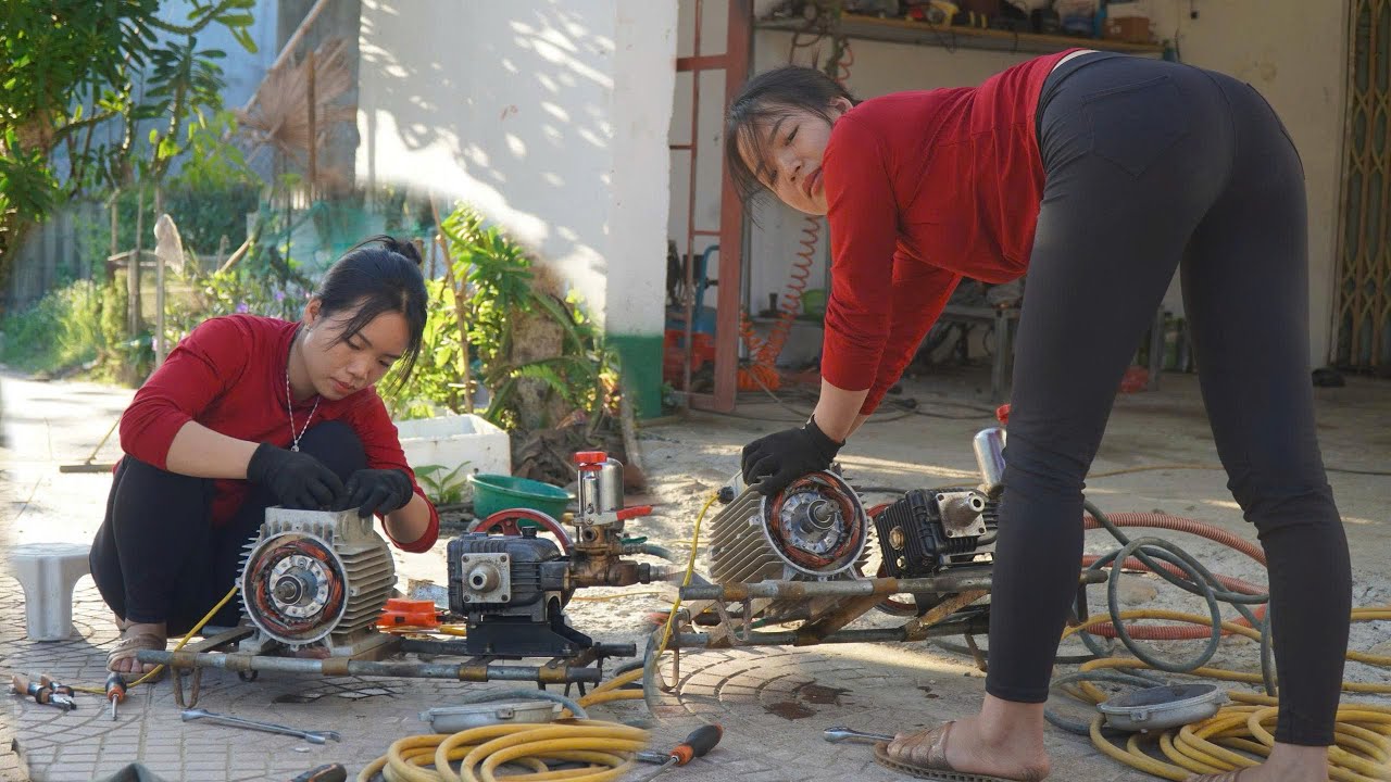 Girl repairs high-power electric motor used for compressor pump