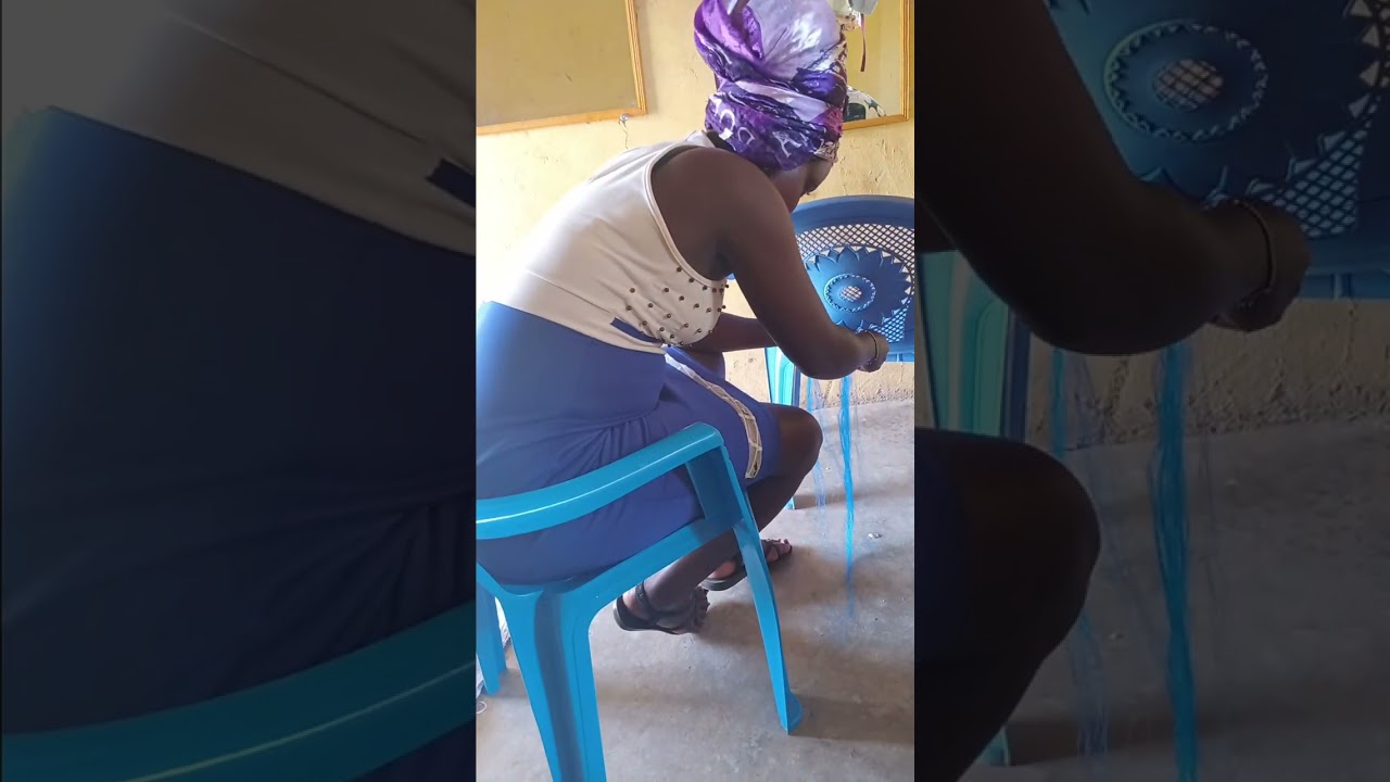 Teaching neema  how to make a bandika using braid