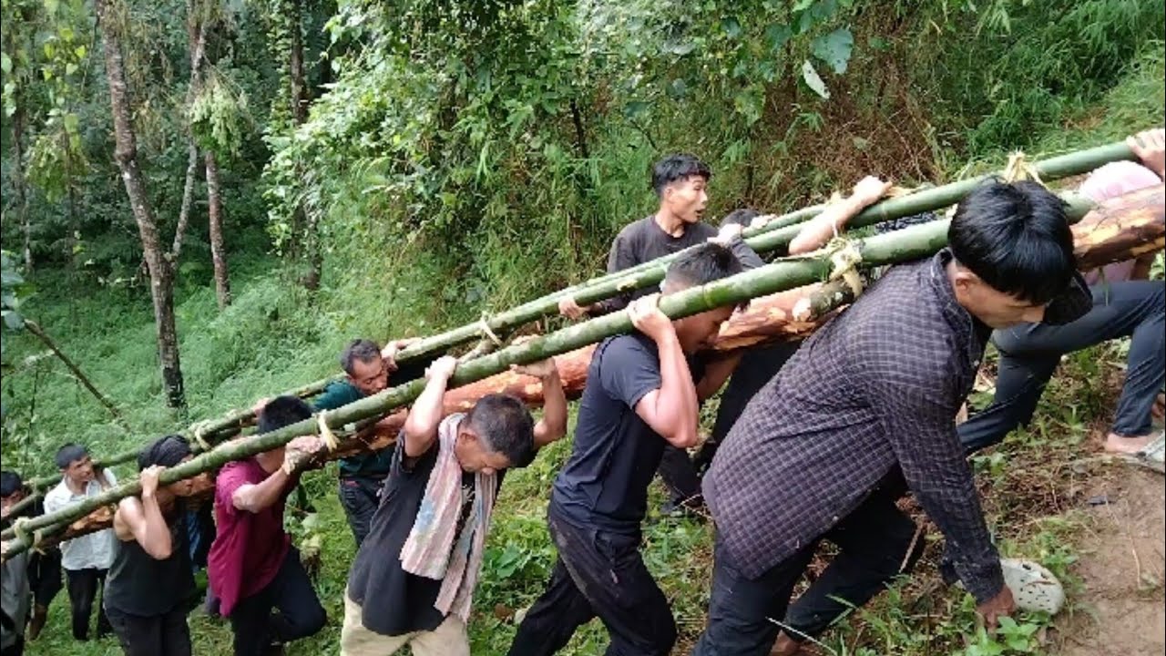 Teamwork Power! 💪 Carry wooden beam by shoulder.