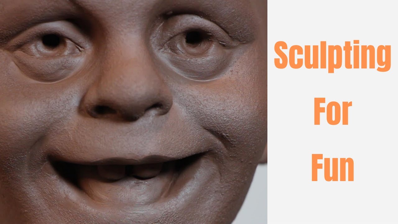 Sculpting silly face in clay . Sculpting for fun. Process of sculpting and playing with clay.