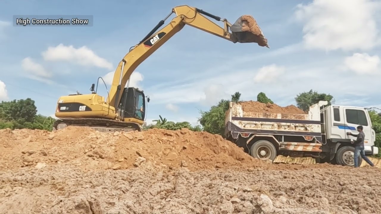 Skilled Excavator Operation Loading Dump Trucks Construction