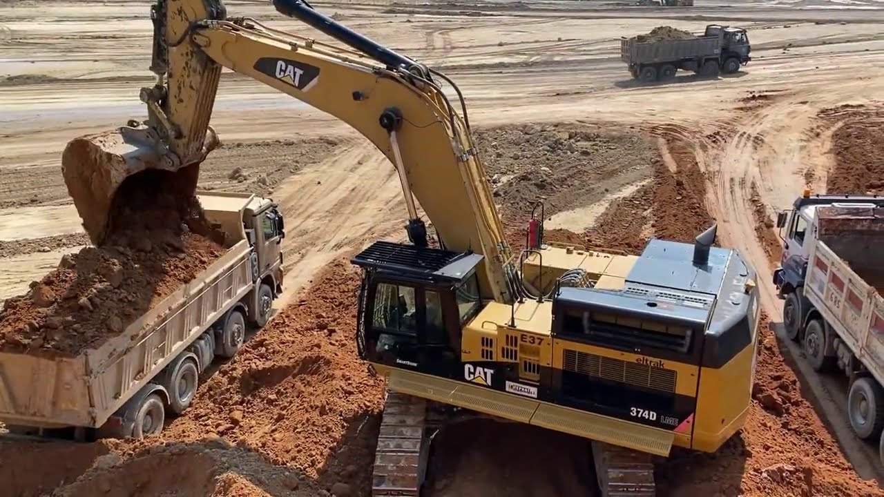 Caterpillar 374D Excavator Loading Trucks