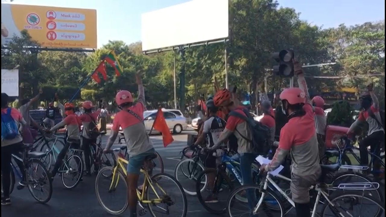 Myanmar anti-coup protests enter fifth day with cyclists and three-finger salute | AFP