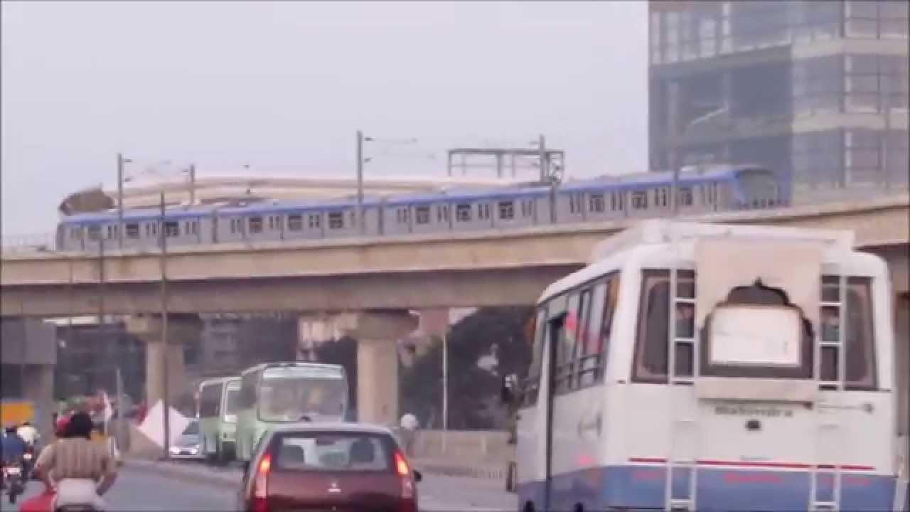 Chennai metro train towards Alandur crosses Adyar bridge