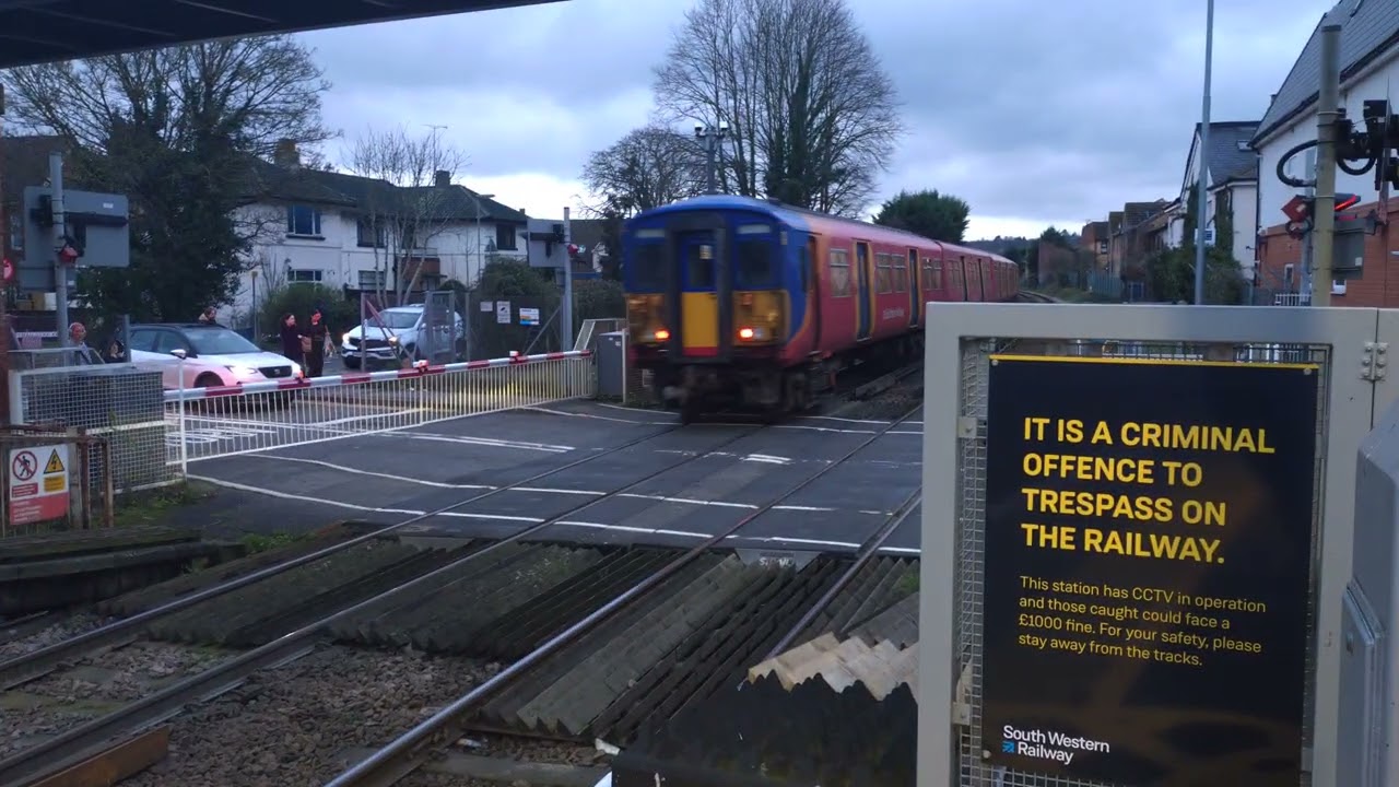 4 car Class 455732 departing Egham for Weybridge working 2S47 with 8 car class 458 arriving.