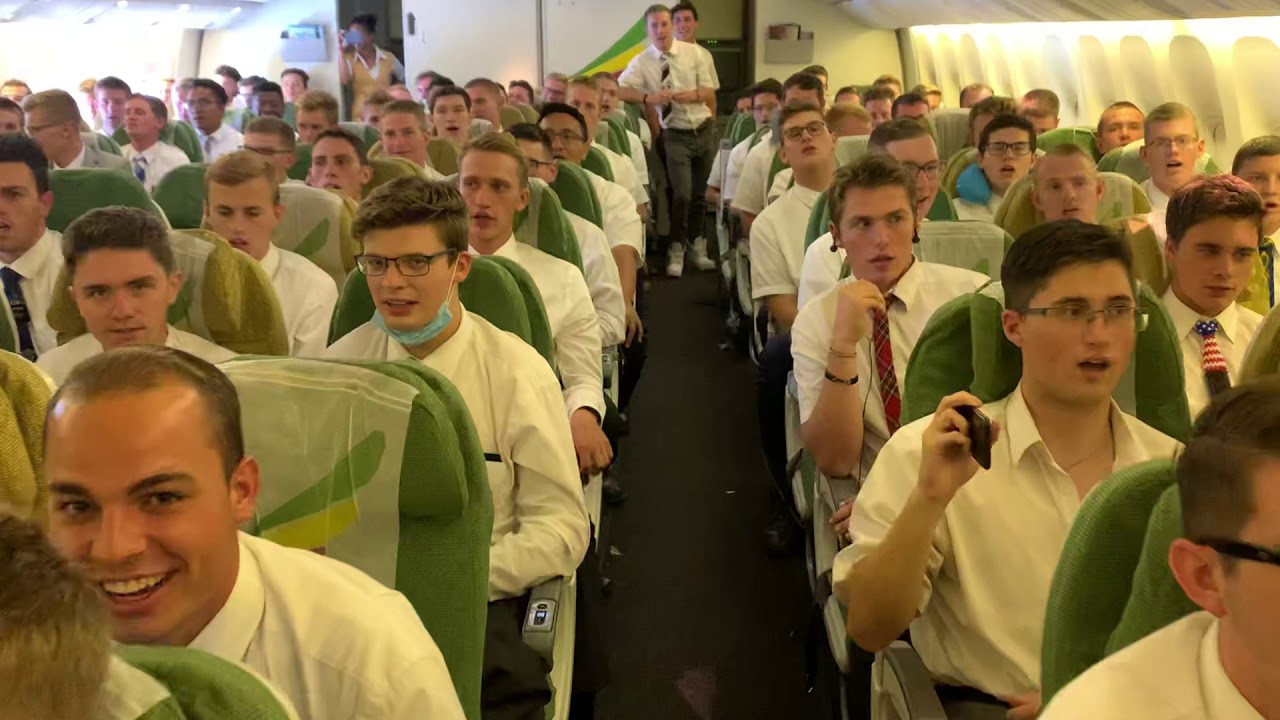 Missionaries Singing on Plane from Africa.     Read below for details