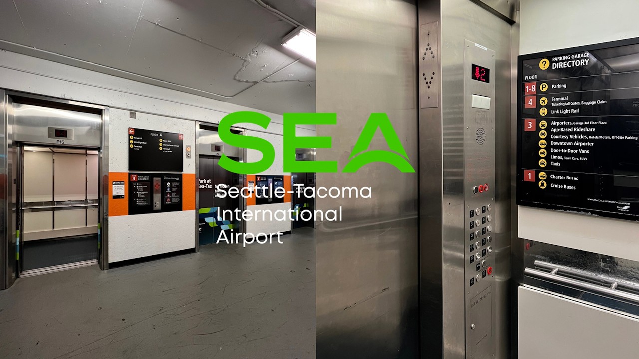 Лифты Montgomery Traction [оранжевого цвета] - Парковка аэропорта SEATAC - Сиэтл, штат Вашингтон
