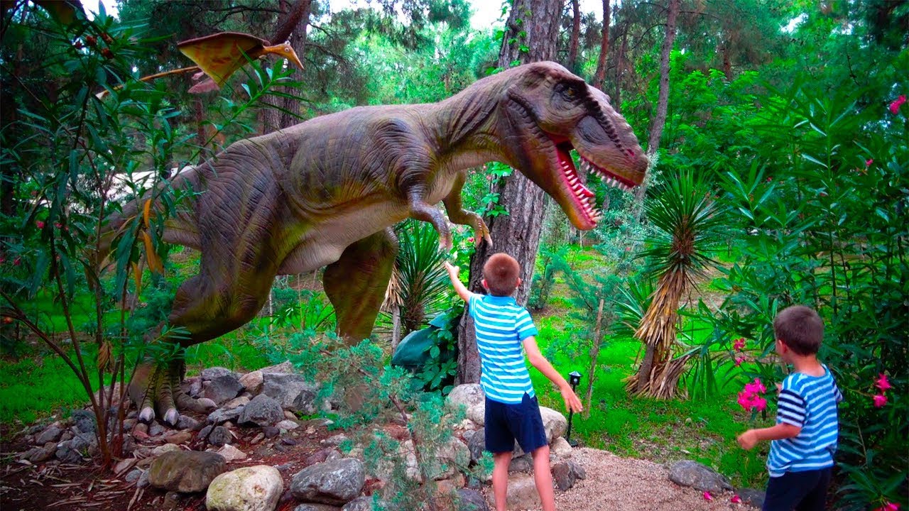 Children visiting Dino Park with Real Size Dinosaurs move & roar - Kidscoco Family Adventure Part II