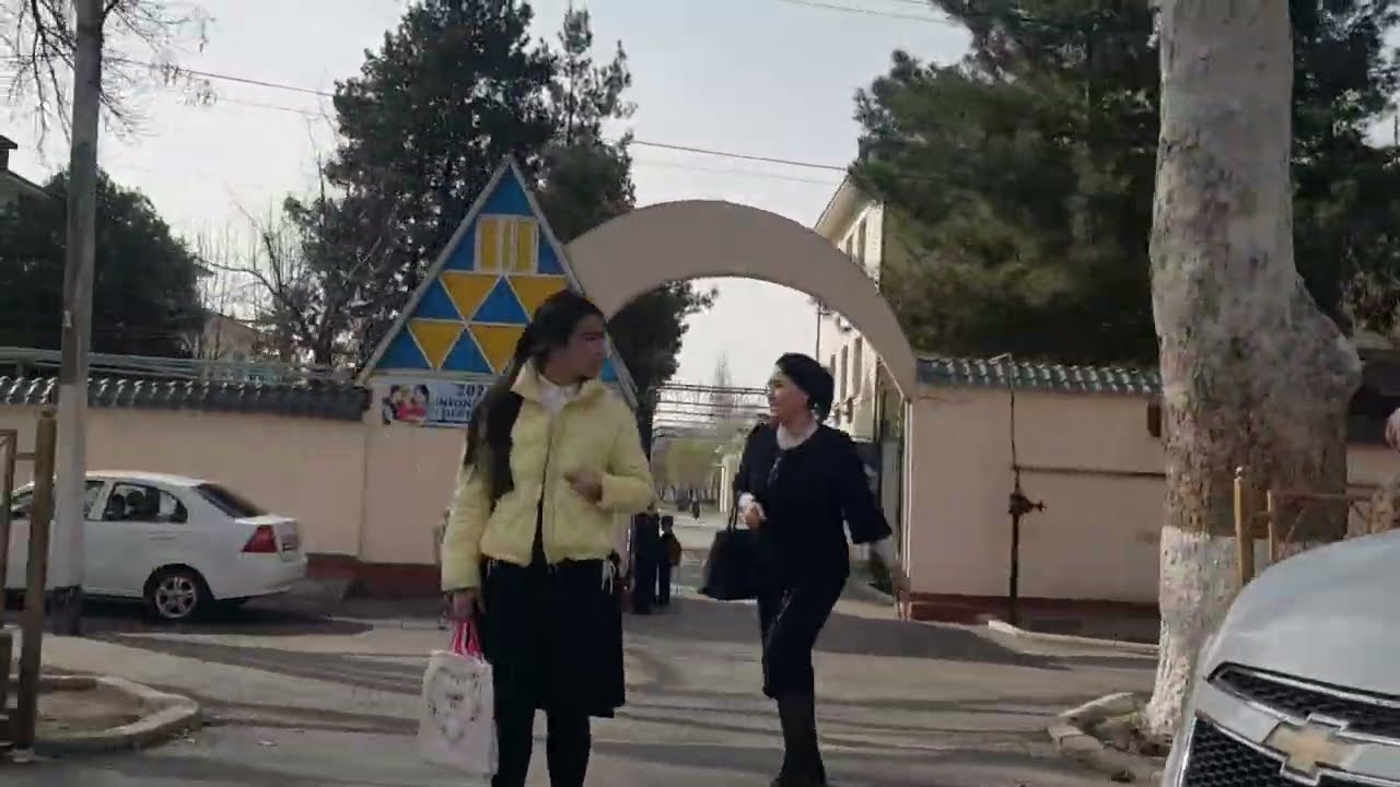Margilan city streets, people, houses. March 10, 2023