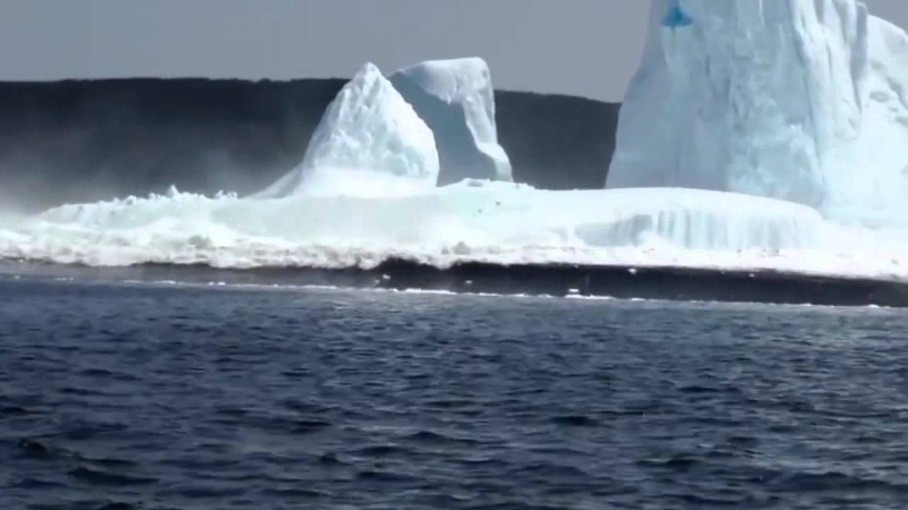 Viral News : Iceberg crashes into sea near panicking woman.