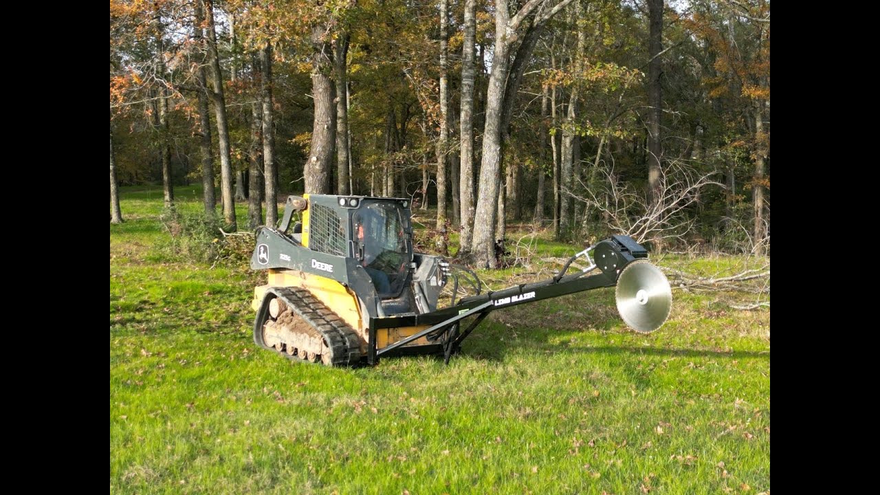 Limb Blazer putting in work around the hay barn.  Skid Steer limb saw.