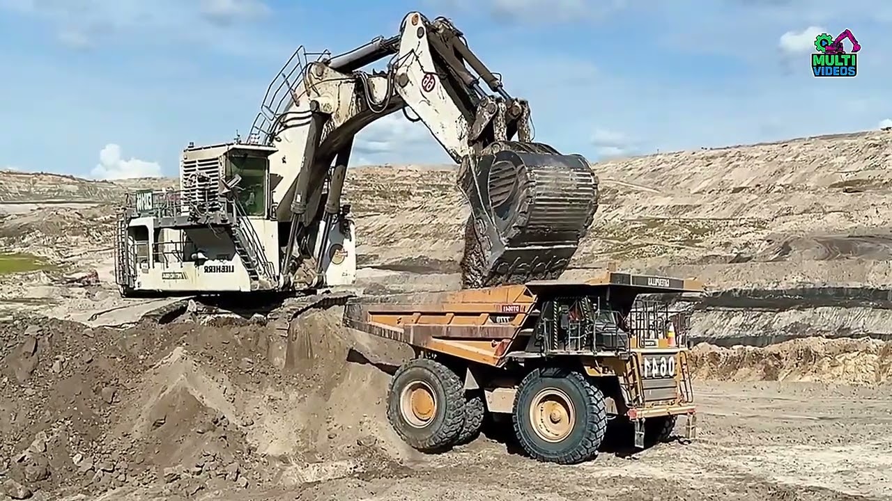 Massive Earthmoving Action: Komatsu HD785-7 Dumper Overloaded with Overburden by Liebherr R 9350