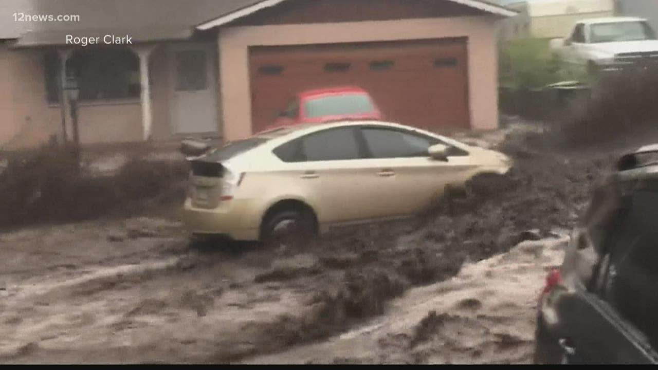 Flagstaff floodwaters rushing into homes, carries away car