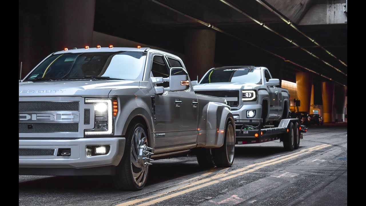 Twin Turbo GMC On 30's Being Towed By F350 On 26's