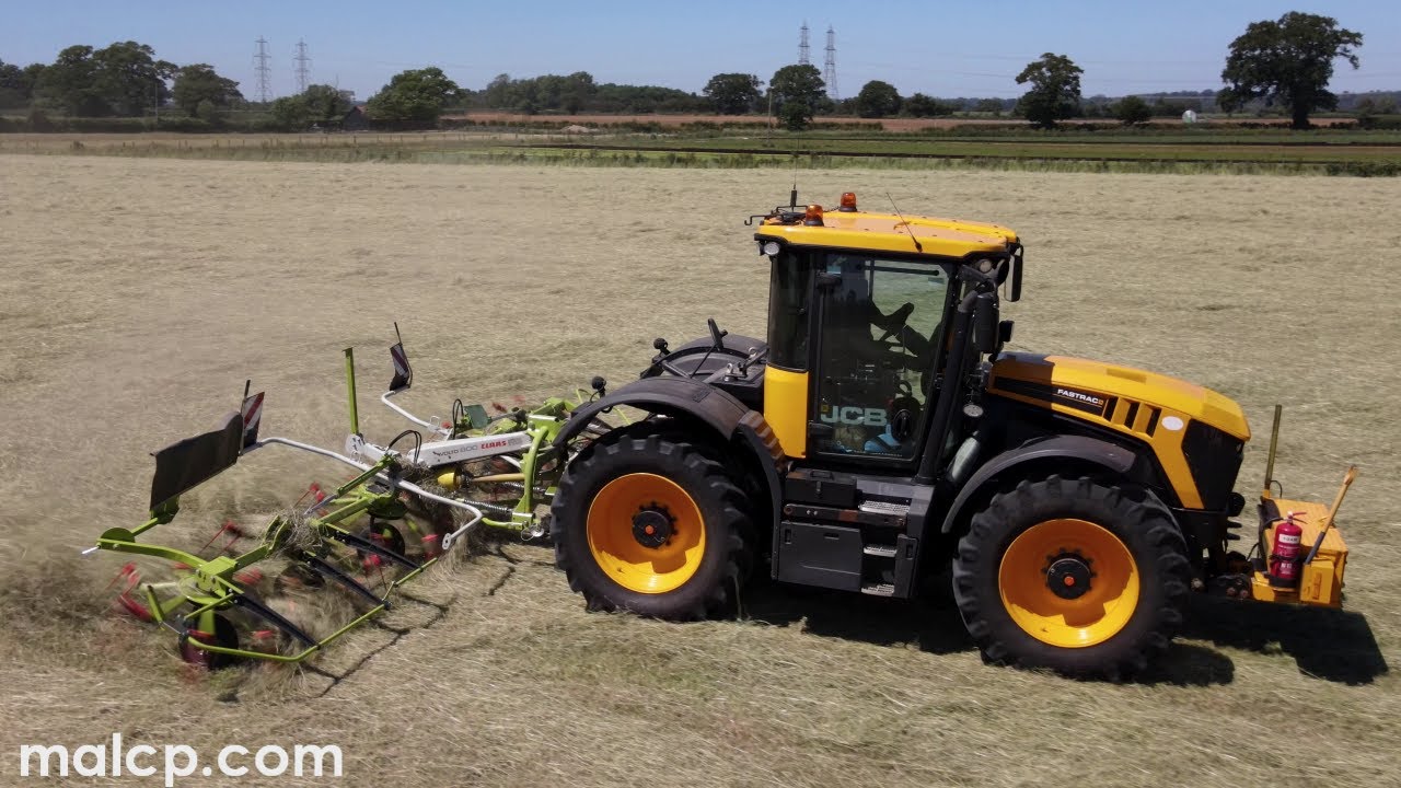 D.E. Keeble's Fastrac 4220 pulling their new Claas Volto 800 tedder