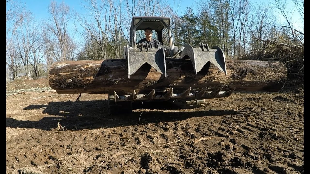 Clearing land with excavator and skidsteer